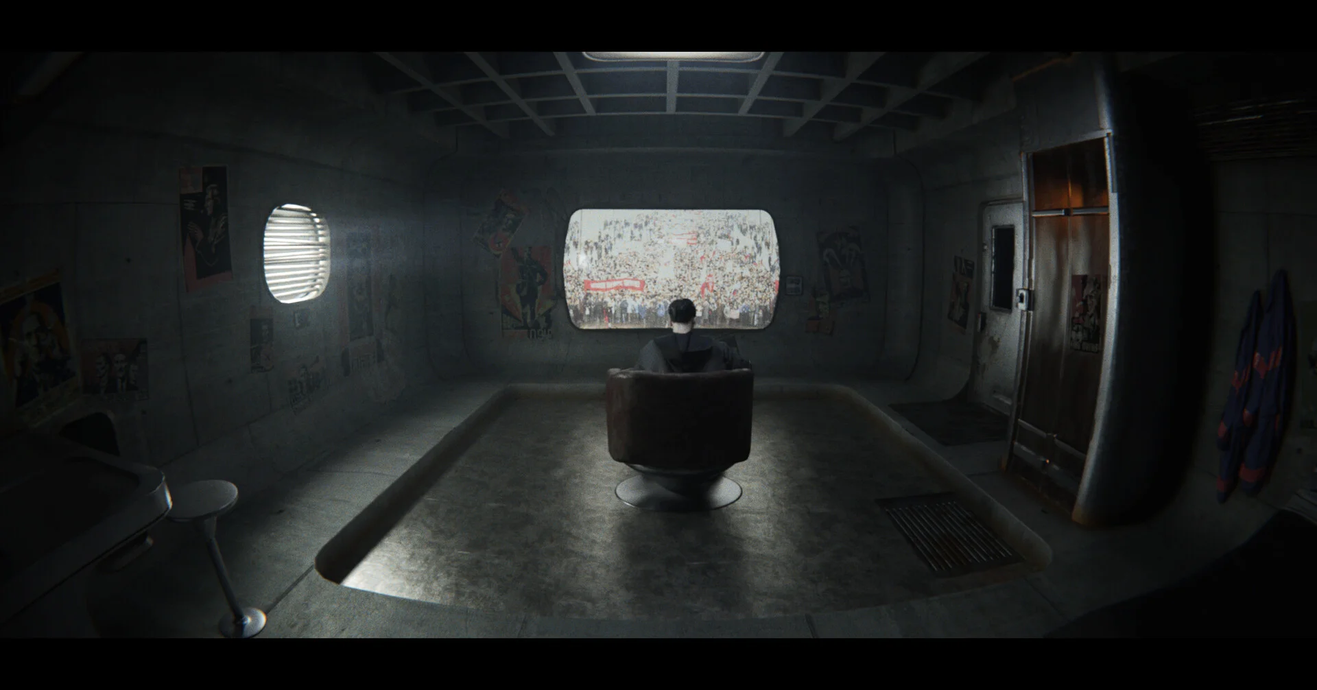A lone figure in a brutalist concrete room watching a screen filled with a crowd