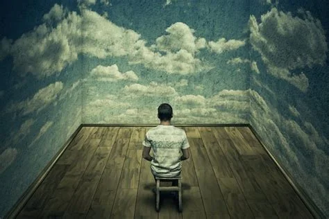 A figure sits enclosed in a room whose walls are painted with photographs of skies
